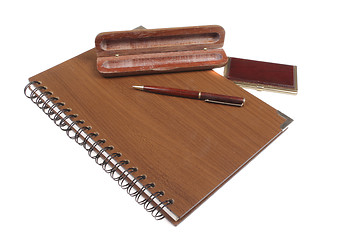 Image showing wooden notebook with pen isolated