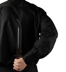 Image showing Holding Knife Behind His Back