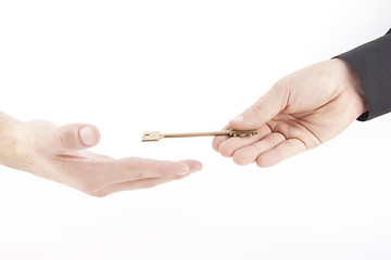 Image showing Male hand holding golden key