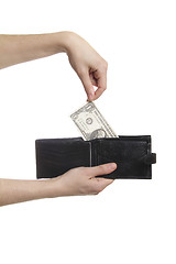 Image showing hand-pulling the dollar from purse isolaetd