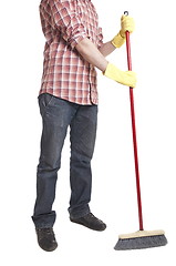 Image showing young worker with a broom