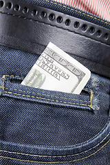 Image showing Stack of dollar bills in jeans pocket