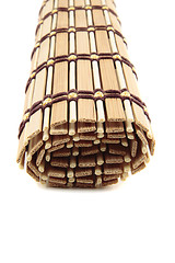 Image showing folded bedding wooden tea isolated