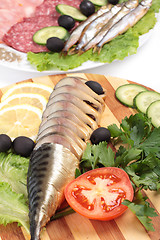 Image showing sliced herring on wooden plate