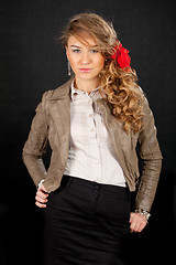 Image showing Beautiful model with red bow, isolated on black background.