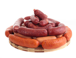 Image showing delicious sausages on board