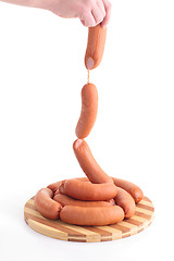 Image showing Sausages in hands