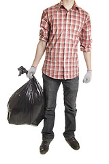 Image showing Man holding black plastic trash bag