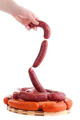 Image showing hand holding sausages
