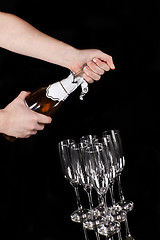 Image showing man hands opening champagne bottle