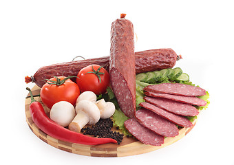 Image showing sliced sausage with vegetables and red papper