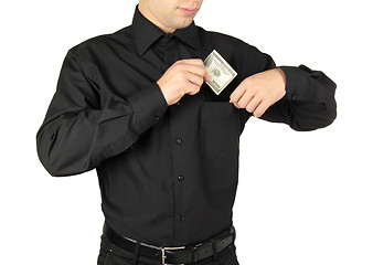 Image showing Businessman putting money in shirts' pocket