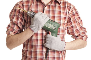 Image showing hands handling an electric drilling machine