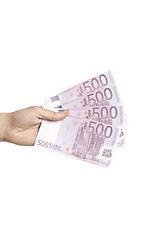 Image showing Male hand holding four 500 euro notes isolated