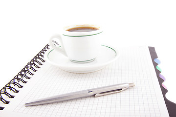 Image showing Coffee and pen on notebook