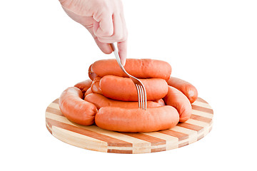 Image showing taste delicious sausages on board
