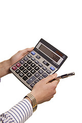 Image showing Male businessman using a calculator