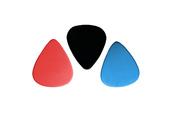 Image showing Closeup of 3 colourful plectrums isolated