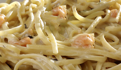 Image showing Italian pasta close-up on yellow gradient surface.