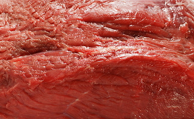 Image showing A close-up view of four rump steaks on a white background.