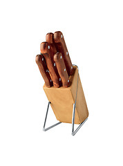 Image showing Set of knives in a wooden knife block isolated