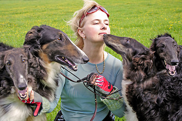 Image showing woman with the thoroughbred borzoi dogs