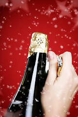 Image showing Opening champagne bottle