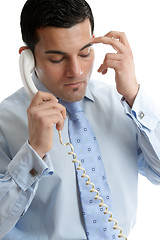 Image showing Troubled or depressed businessman making call