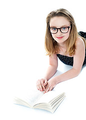 Image showing Girl wearing eyeglasses and reading book