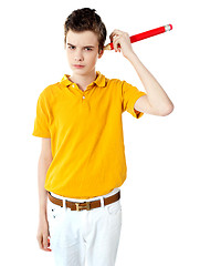 Image showing Boy cleaning his ear with big pencil