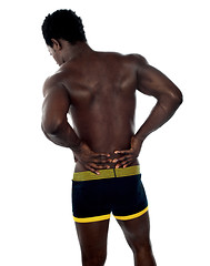 Image showing Back pose of young fit male trainer