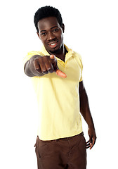 Image showing An african male pointing at you