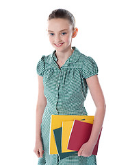 Image showing School girl carrying books in hand