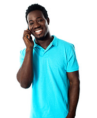 Image showing Casual young man communicating on phone