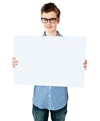 Image showing Handsome boy showing an empty billboard