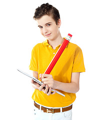 Image showing Cute boy writing on his notebook