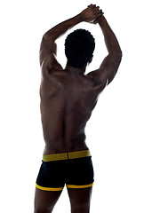 Image showing Shirtless african fit guy. Back pose