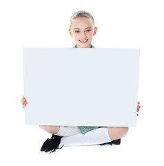 Image showing School girl showing blank billboard