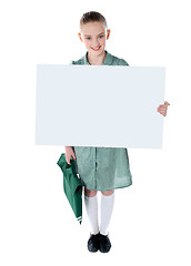 Image showing Cute school girl with an advertising board