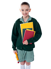 Image showing School girl standing with notebooks