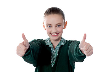 Image showing Little girl showing thumbs up to camera