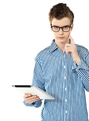 Image showing Trendy techy boy thinking something