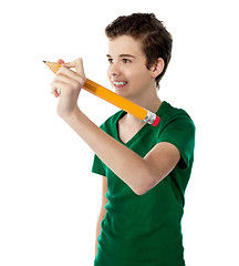 Image showing Smiling boy making imaginary drawing