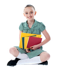 Image showing Beautiful girl holding school books