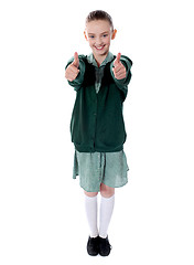 Image showing Double thumbs up by young american girl