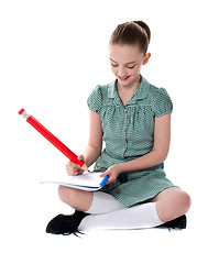 Image showing Young girl doing her homework