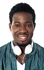 Image showing Guy with headphones around his neck