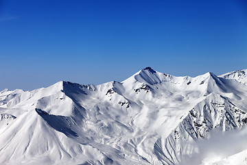 Image showing Snowy mountains and blue sky