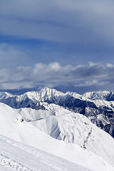 Image showing Ski slope and snowy mountains