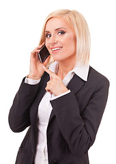 Image showing happy female executive speaking on a cellphone